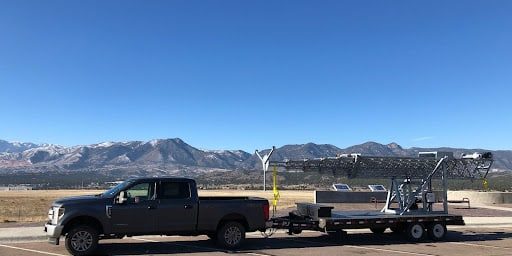 Mobile coverage expansion in a rural area with a cell-on-wheels from Solaris Technologies Services.