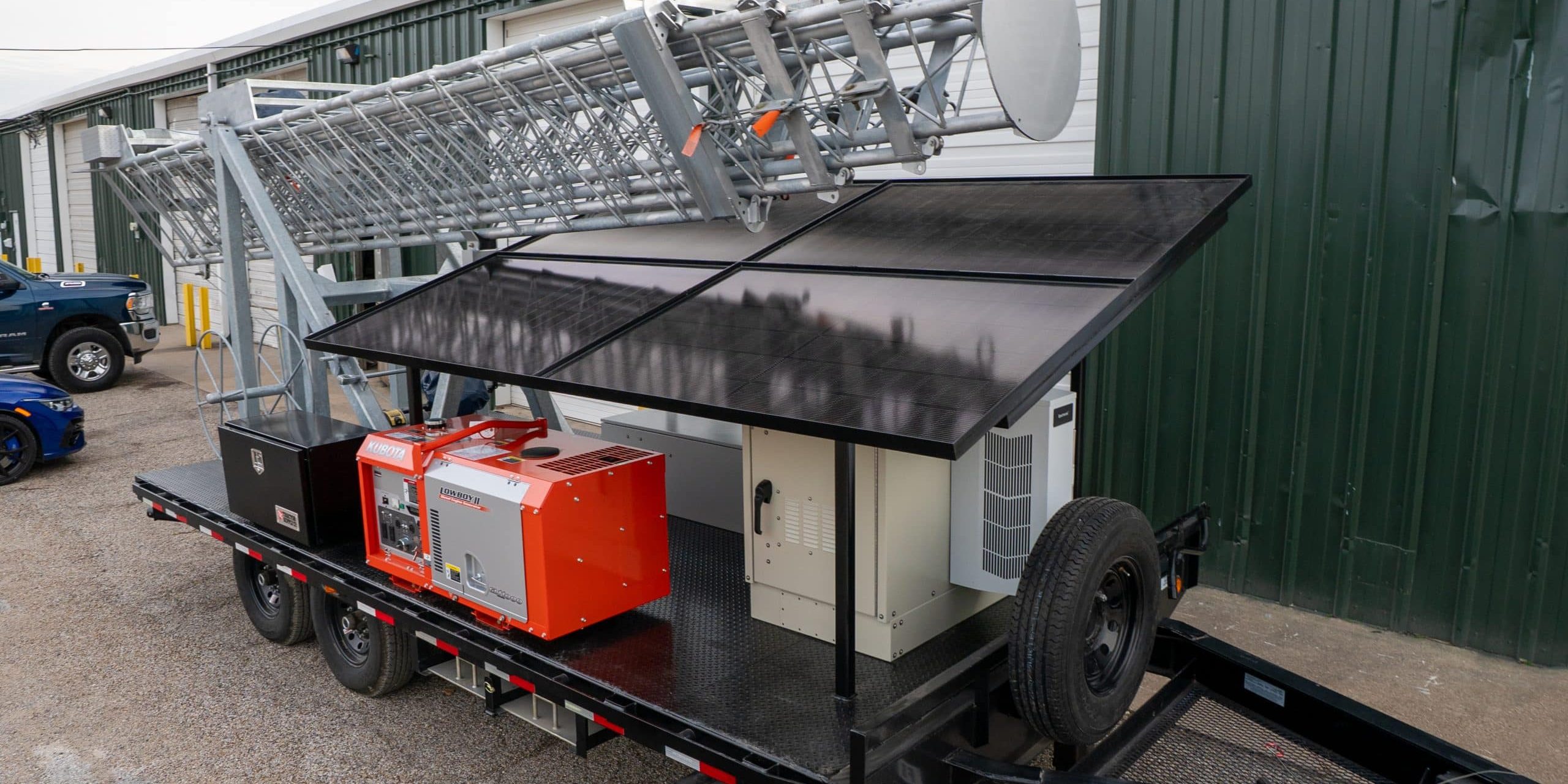 Solaris-04 Hybrid power telecom tower from Solaris Technologies Services combining solar panels, shore power, and generator backup for reliable mobile connectivity.